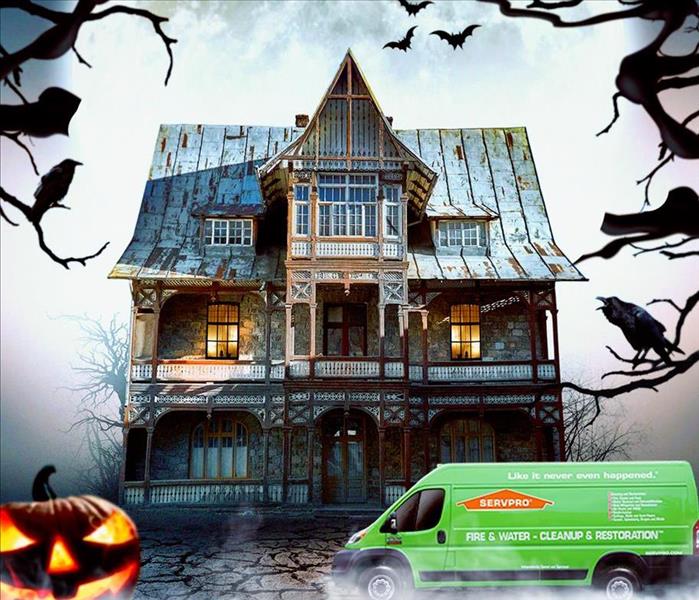Haunted House with pumpkin and SERVPRO van in front